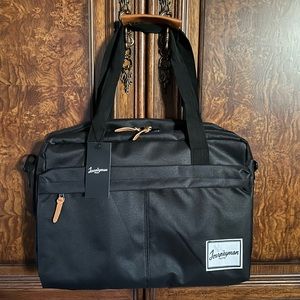 NWT The Journeyman Bag Co Duffle Bag in black with red mesh interior.